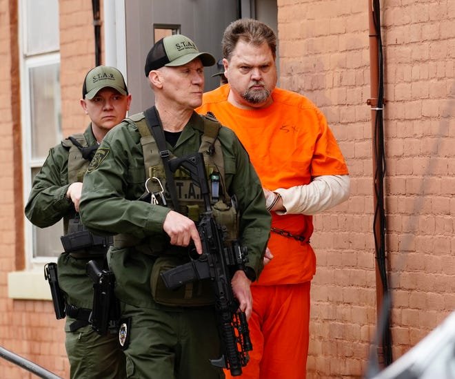 George "Billy" Wagner III exits the back of the Pike County Courthouse after a hearing in March. Wagner attended the 11-minute hearing in jail attire, despite earlier winning a request to appear in street clothes.