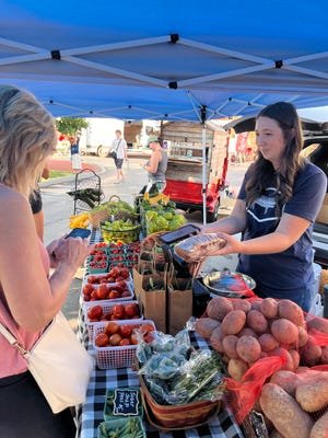 Tomatoes, potatoes, snap peas and other vegetables are on display at the New Albany Farmers Market, which opens June 6.