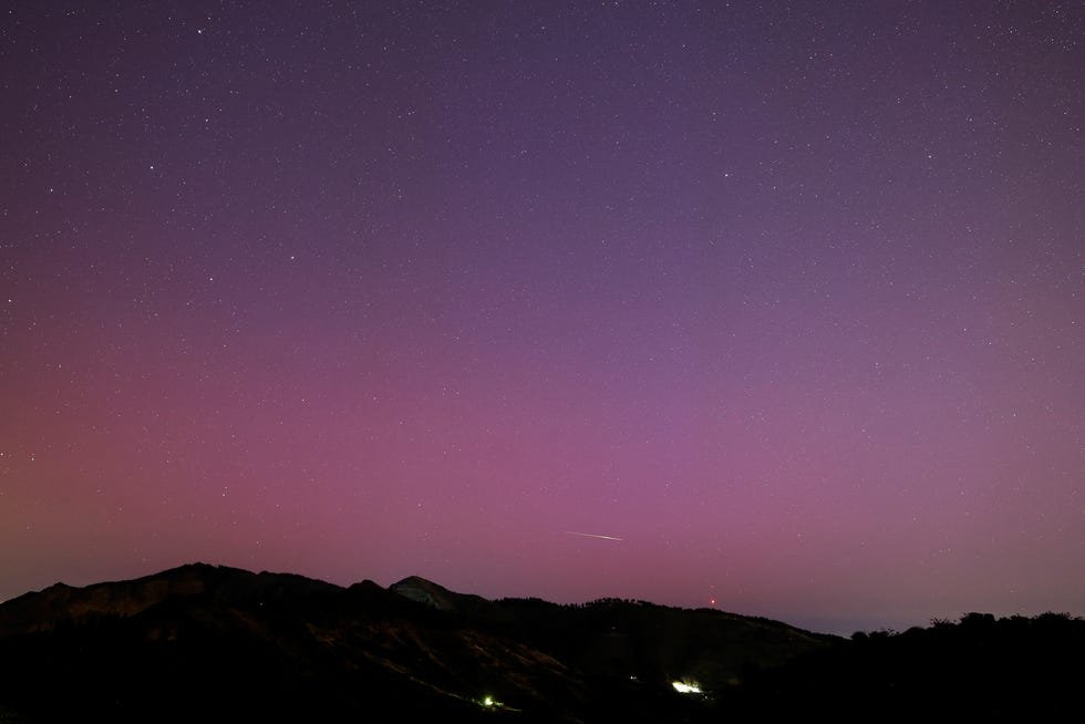 An aurora borealis is seen over the island of Gran Canaria from Pico de las Nieves, Spain, May 11, 2024. REUTERS/Borja Suarez