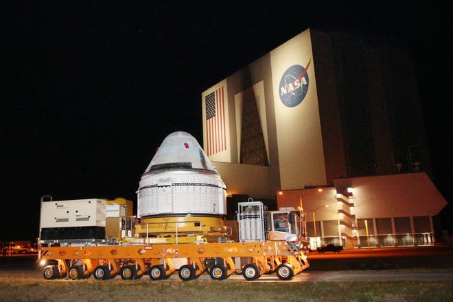 A Boeing CST-100 Starliner spacecraft is rolled out April 16 from a Boeing's facility past NASA's Kennedy Space Center in Cape Canaveral, Florida. A crew is set to launch Monday to the International Space Station aboard the Boeing capsule.