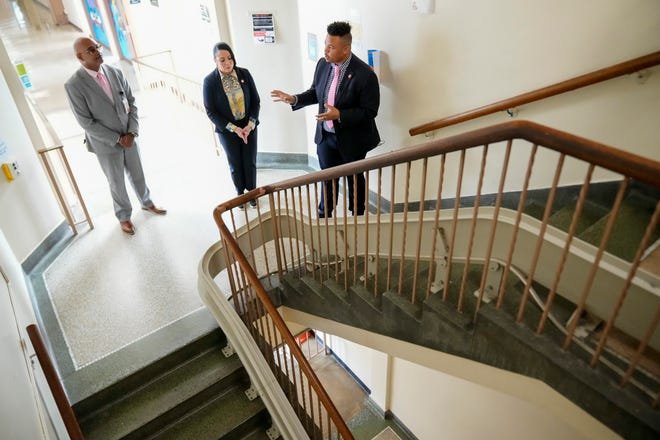May 14, 2024; Columbus, Ohio, USA; From right, Columbus City Schools board member Brandon Simmons, board president Christina Vera and principal Darryl Sanders lead a tour of Columbus Alternative High School. The building was included on a proposal of potential closures for the district.