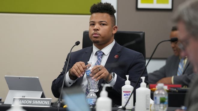 Columbus City School board member Brandon Simmons sits at the beginning of the May 21 meeting. Prior to the meeting starting, he apologized and placed blame for a leaked memo concerning the school closure process.
